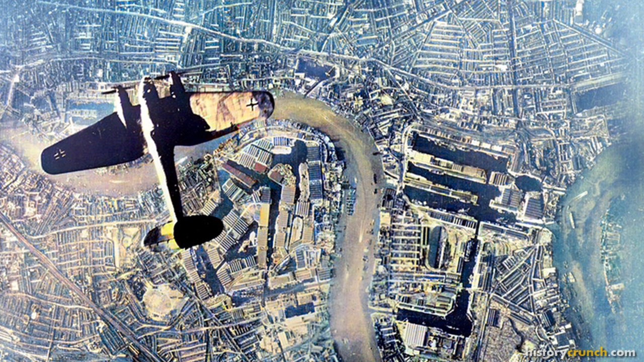 Nazi German bomber flying over London, England during the events of the Battle of Britain in September of 1940. (Colorized by historycrunch.com)