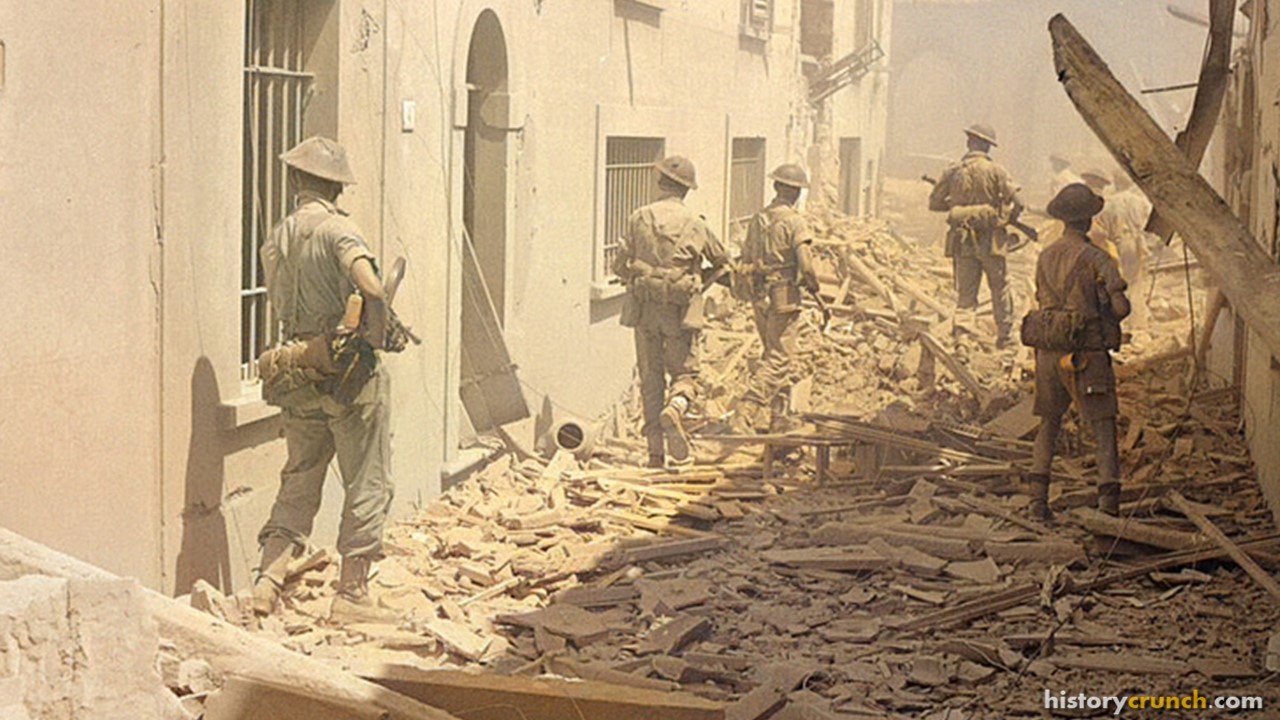 British infantry in ruined streets during the Italian Campaign of World War II, in August of 1944. (Colorized by historycrunch.com)