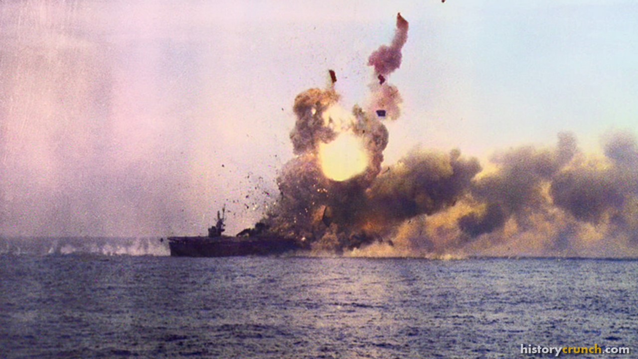 Explosion following the impact of the Kamikaze aircraft against the USS St. Lo, which sank from the attack. (Colorized by historycrunch.com)